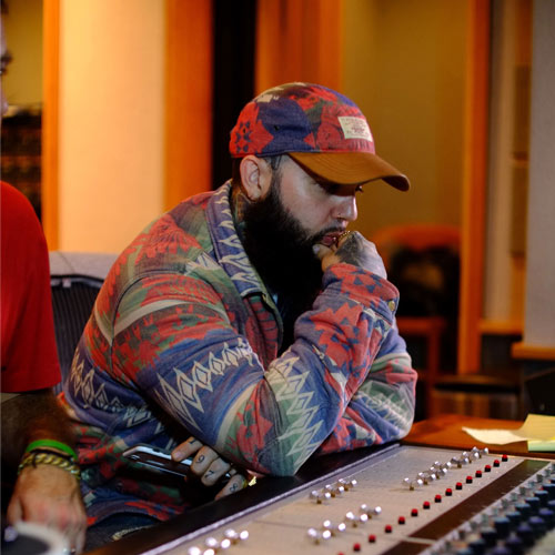 Kingdom Kome seated during a SpitFireHipHop interview, discussing Dirty Linens 2 and Barrel Reserve, representing independent underground Hip-Hop culture and lyrical artistry.