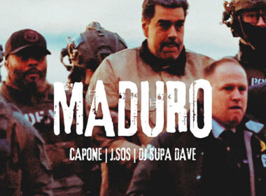 Capone stands front and center in a dim, gritty urban setting, wearing a dark hoodie and chain, staring confidently into the camera while J.SOS appears slightly behind him in soft focus; dramatic red and gold lighting cuts through light smoke as DJ Supa Dave works a turntable in the background — cinematic hip-hop atmosphere for ‘Maduro’ feature on SpitFireHipHop.