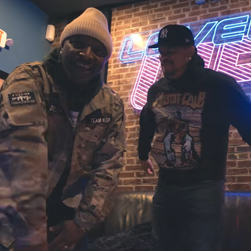 Dell-P stands confidently in an urban Philadelphia setting, delivering intense performance energy in “Superhero Flow,” symbolizing lyrical power, independence, and modern underground Hip-Hop visual storytelling.