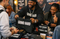 Independent Hip-Hop artist selling merchandise directly to fans, representing the rise of the direct-to-fan economy in modern rap
