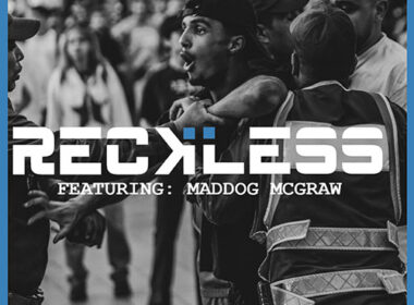 Black-and-white Hip-Hop street scene with police confrontation, bold “RECKLESS” title text — representing the intensity and chaos of Beat Clinic and Maddog McGraw’s single.