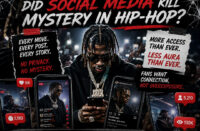 Hip-Hop editorial graphic featuring a rapper surrounded by smartphones, livestream screens, social media notifications, and camera flashes while looking down at his phone in a crowded environment, symbolizing the loss of mystery in modern Hip-Hop due to nonstop digital visibility, with bold headline text “Too Visible: Did Social Media Kill Mystery in Hip-Hop?” and official SpitFireHipHop branding.