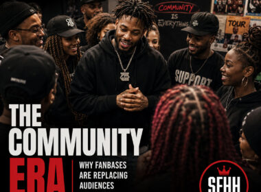 An independent artist standing among a circle of supporters at an intimate event, not performing for them but standing with them. Clean editorial composition, natural lighting, authentic expressions, minimal headline treatment, official SpitFireHipHop logo, human-designed Adobe Illustrator aesthetic.