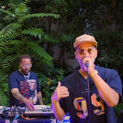 E Reece performs "The Process" and "So Beautiful" live while producer Mr. Sonny James DJs during an outdoor performance in Los Angeles, California.
