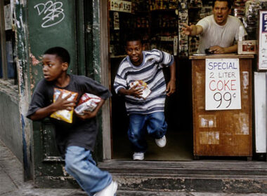 Apollo Brown and Skyzoo “No Discounts” single cover featuring two young boys running from a neighborhood corner store as the shopkeeper reaches toward them.
