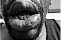 Black-and-white cover artwork for Echo's “Cocky,” produced by DJ Give, featuring a close-up portrait with bright pink title lettering.