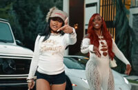 Young Lyric and Claressa Shields appear in the “Can’t FWM” music video in front of luxury vehicles and a modern home.